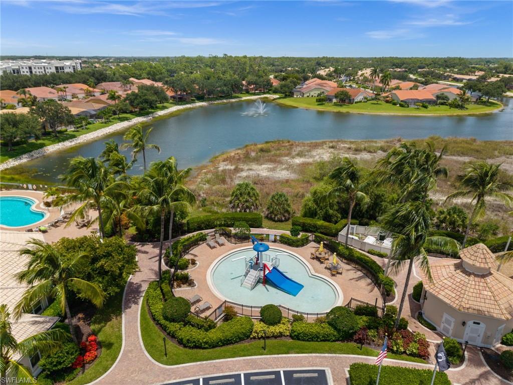 Community aquatic amenities featuring two distinct pools, a structured play slide, and surrounding lounge areas