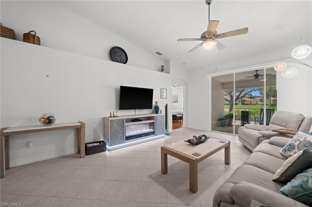 Vaulted ceilings and tile flooring enhance this living space
