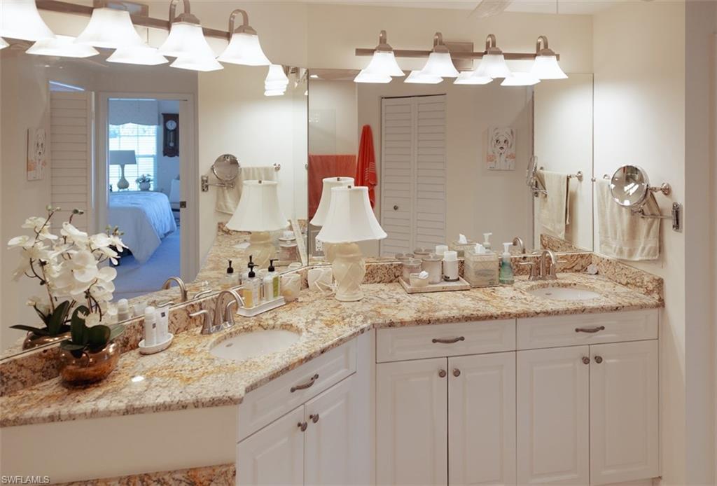 Bathroom featuring dual bowl vanity