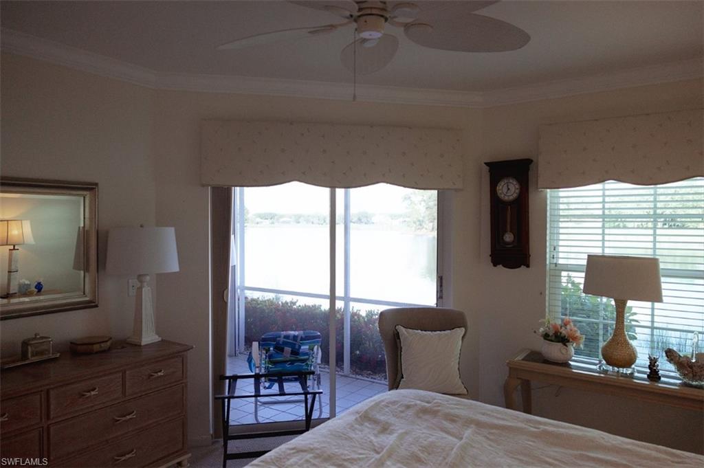 Bedroom featuring ceiling fan and crown molding