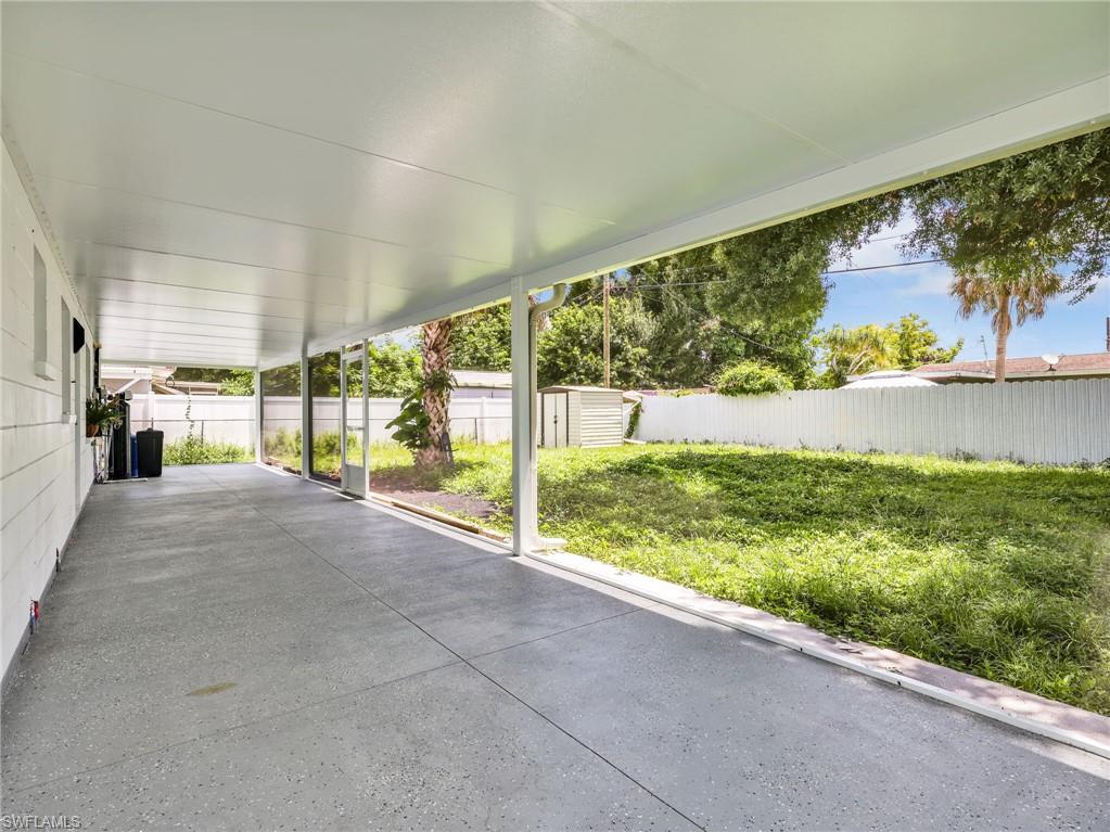 Expansive covered patio featuring a concrete floor and a white metal roof