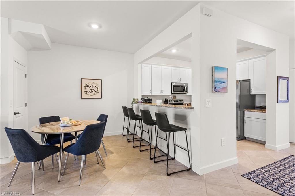 A versatile breakfast bar offers the perfect spot for casual dining or morning coffee