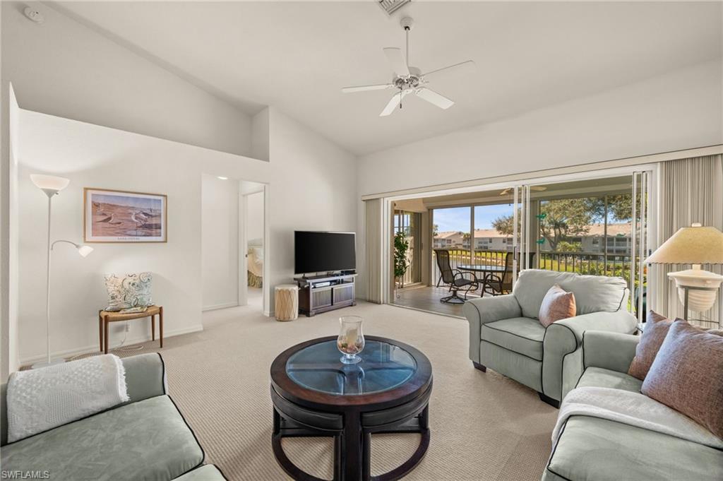 Light-filled living area with soaring vaulted ceilings and open-concept design.