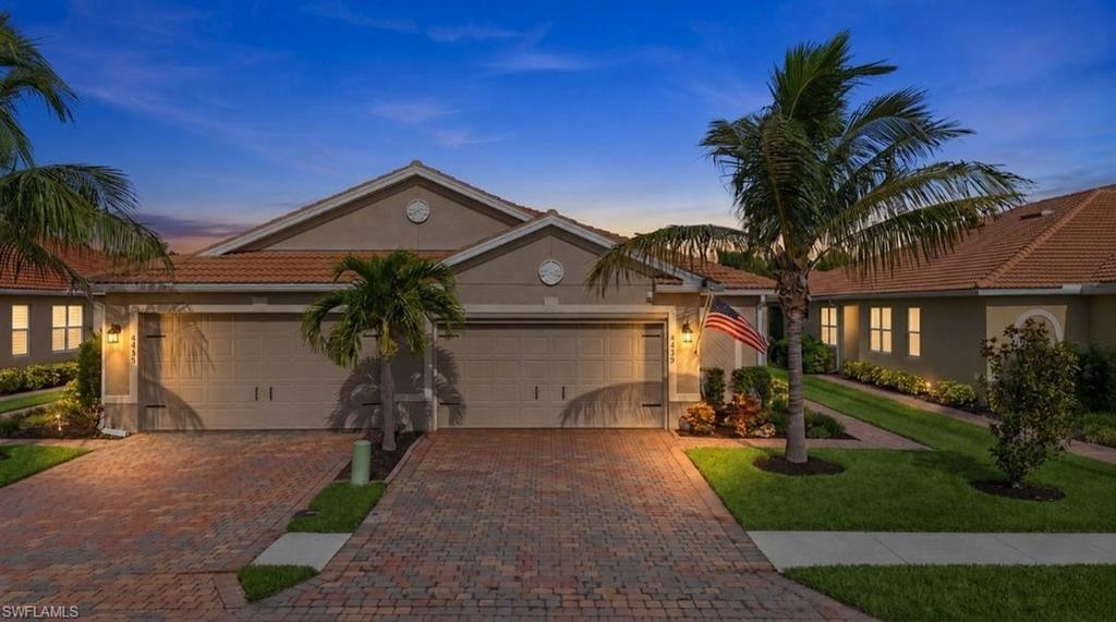 Mediterranean-inspired exterior featuring a tile roof and stucco facade