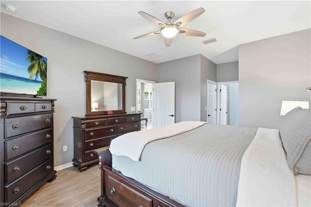 Neutral tone walls complement wood-finish flooring
