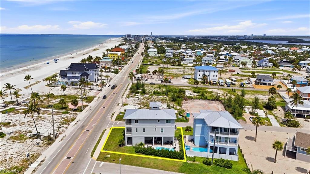 Expansive coastal property featuring a multi-story residence with a private swimming pool - Virtually Edited Image