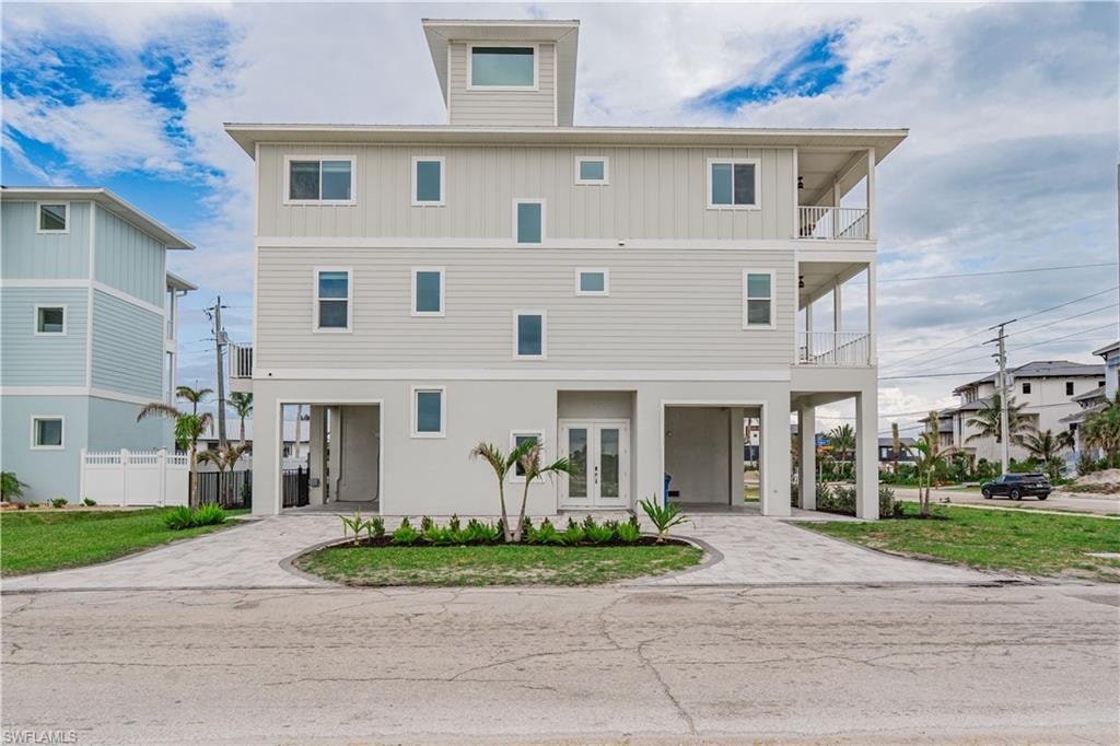 Three-story coastal residence featuring a top-level cupola - Virtually Edited Image