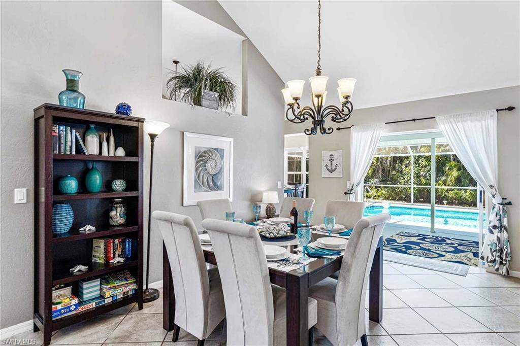 The formal dining area seats 6 & has a view of the pool