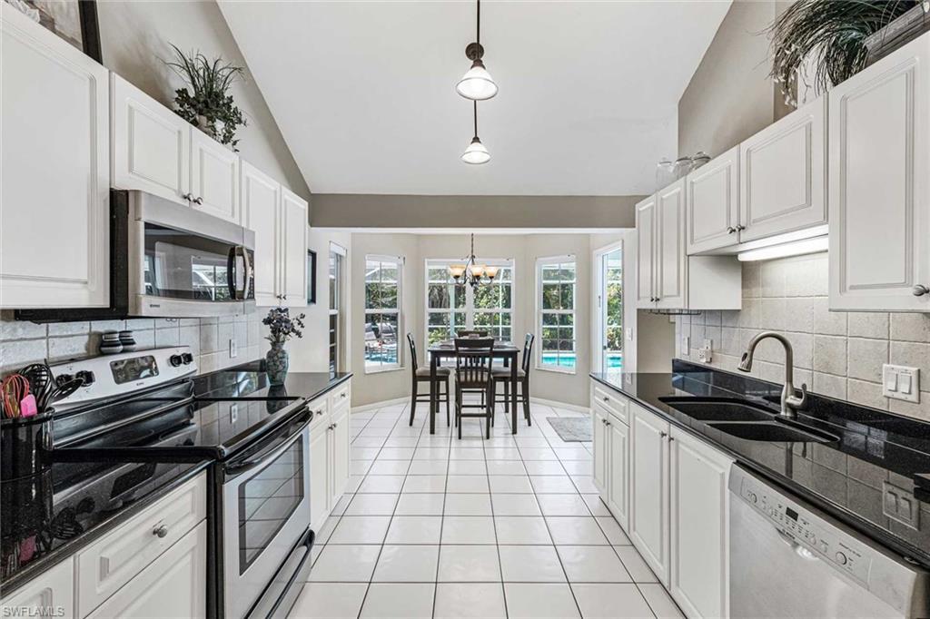 The galley kitchen is well equipped & has a breakfast nook with room for 4