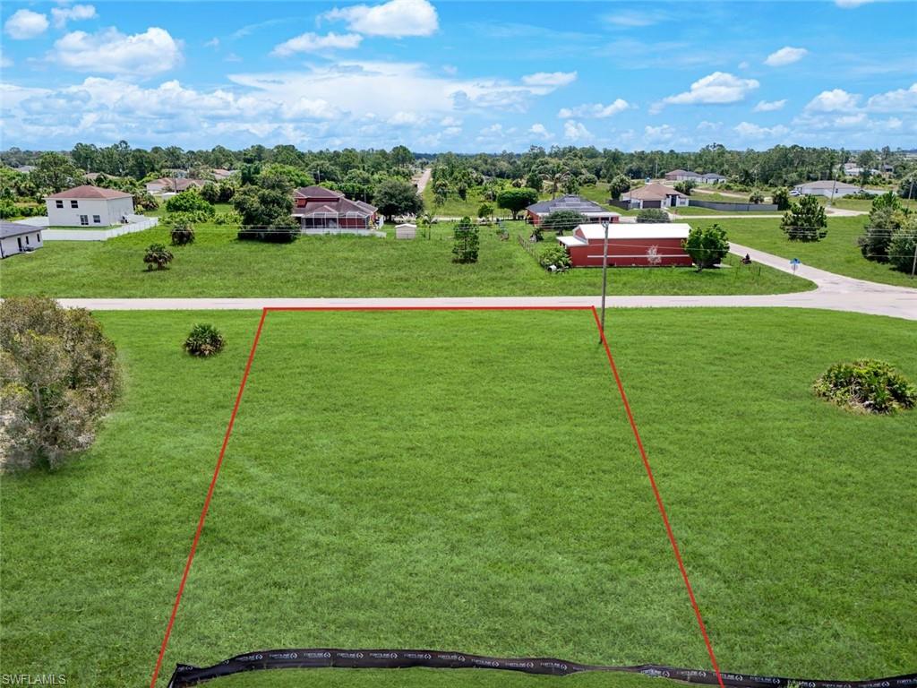 Expansive green lot offering a broad, flat building area