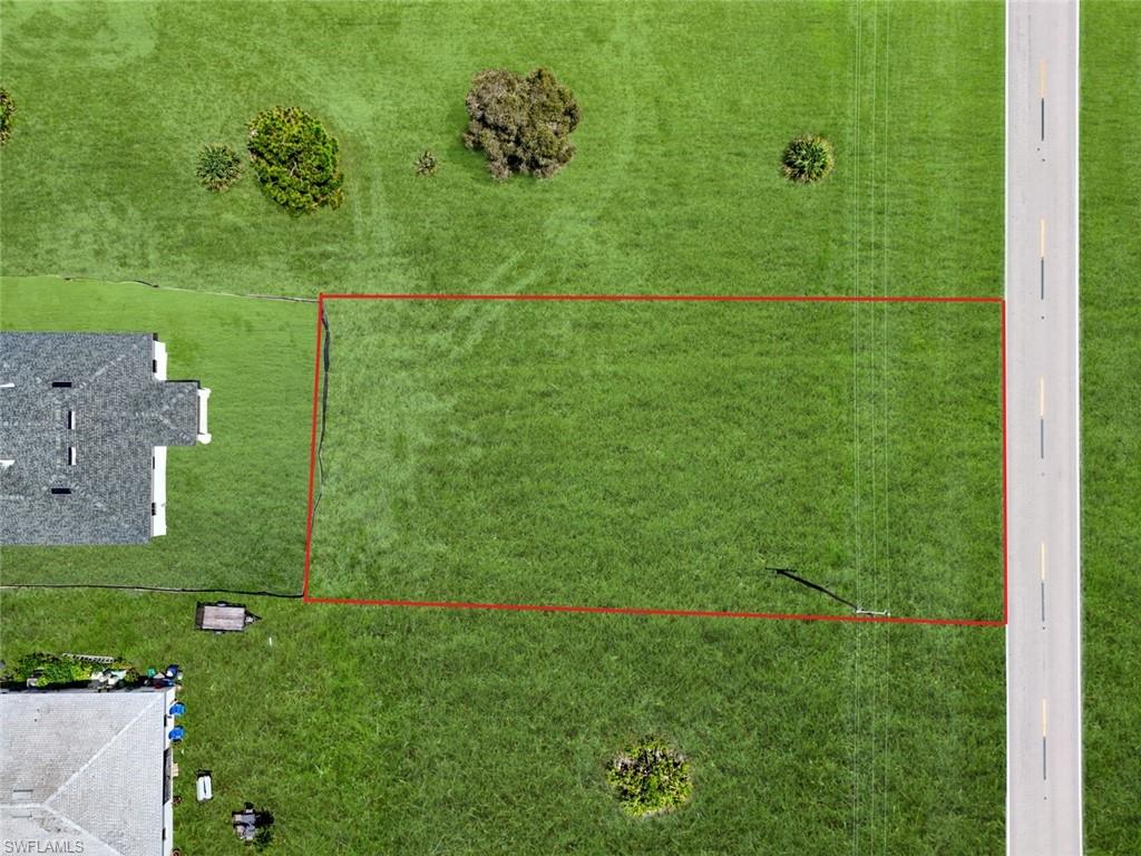 Expansive land parcel featuring a rectangular configuration with a grass surface