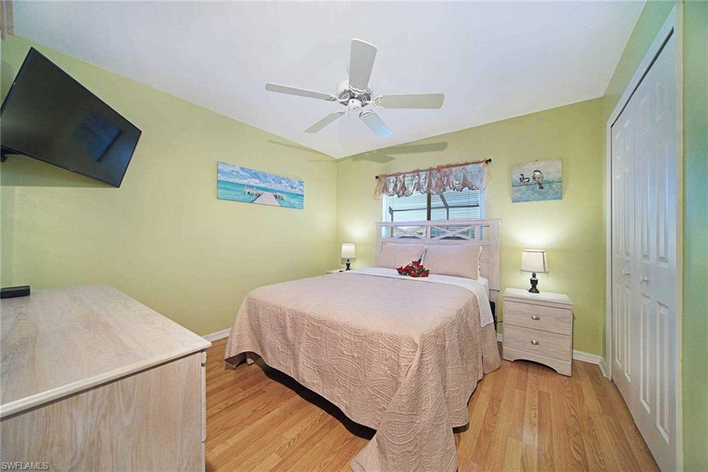 One guest bedroom offers a queen-size bed & flat-screen TV