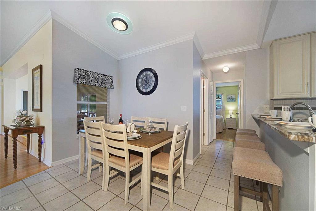 The dining area is off the kitchen and has room for 6