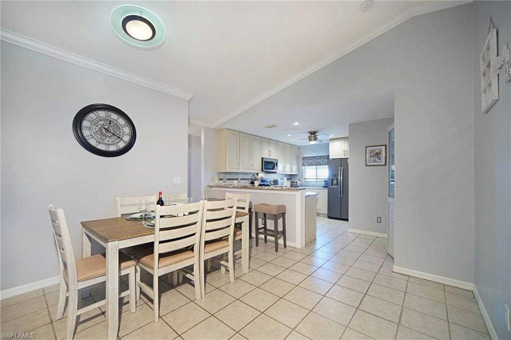 The dining area is between the kitchen and the living room