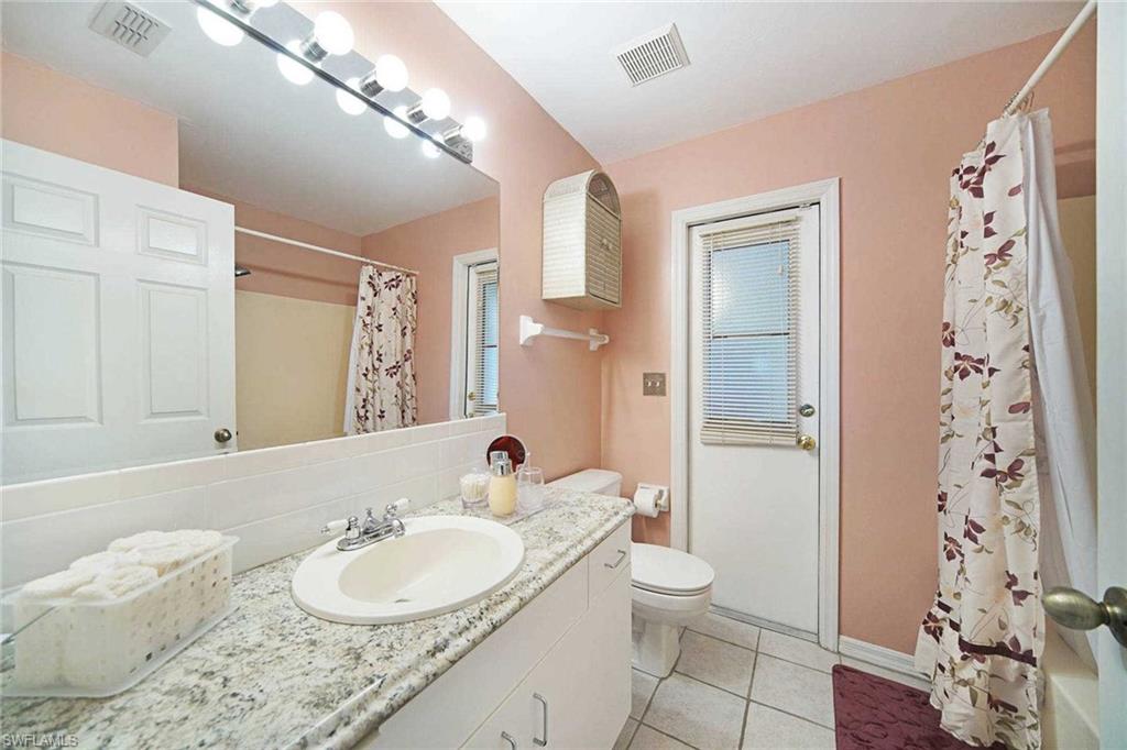 The guest bathroom doubles as the pool bath & has a shower/tub combo