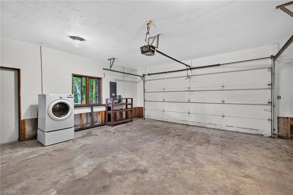 Original baseboards, door casings, and wood trim have been cleaned, sanded, and refinished and are stored in the living room.