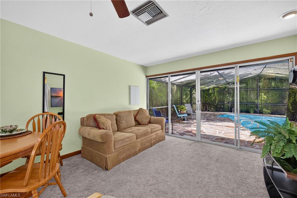 Living room with views of the pool.