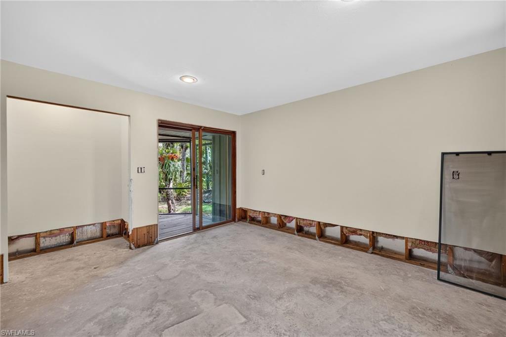 Primary bedroom featuring wood-finish flooring and a ceiling fan