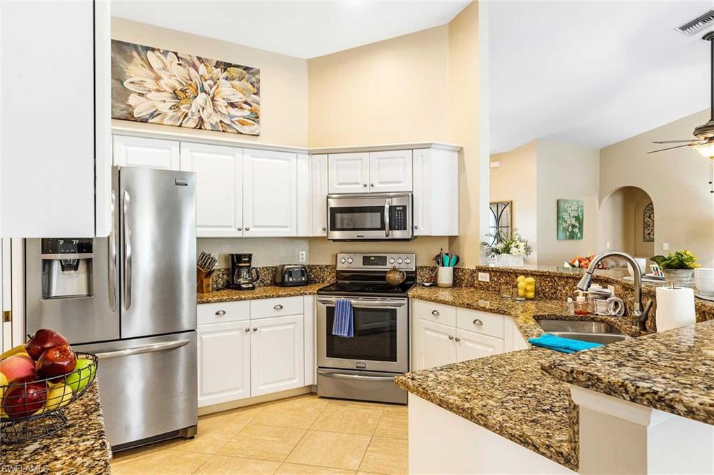 The fully equipped-kitchen has stainless steel appliances