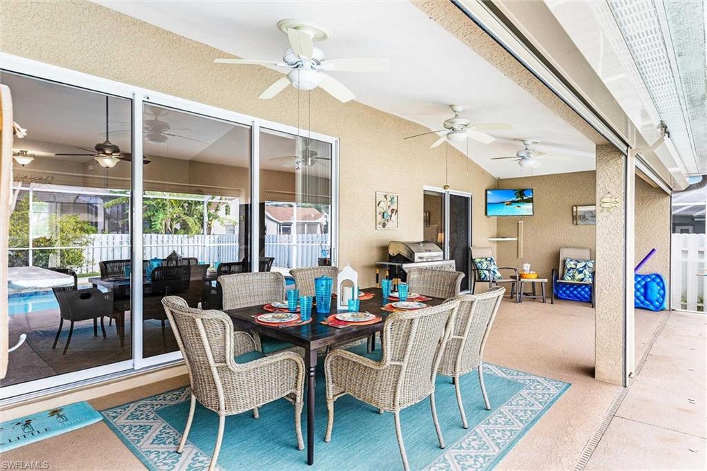 Outside dining with room for 6 and a flat-screen TV
