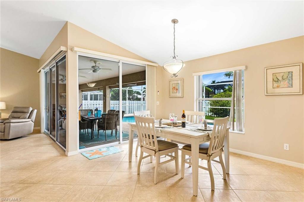 The dining area has a view of the pool area