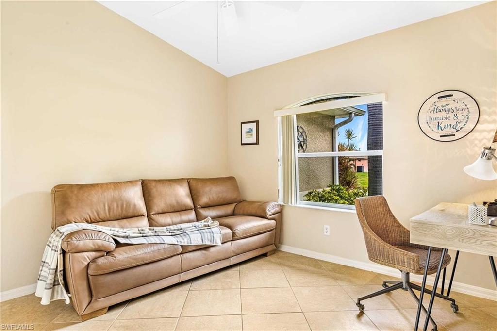There is a separate sitting are with couch and desk