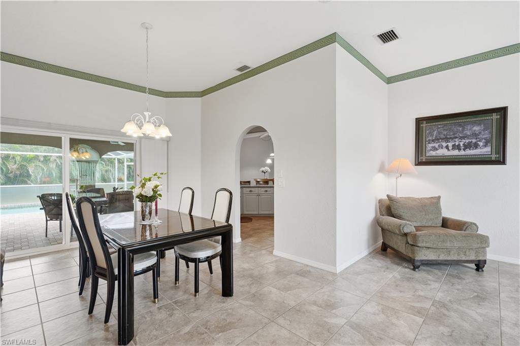 Spacious interior with tile flooring and a decorative green accent band
