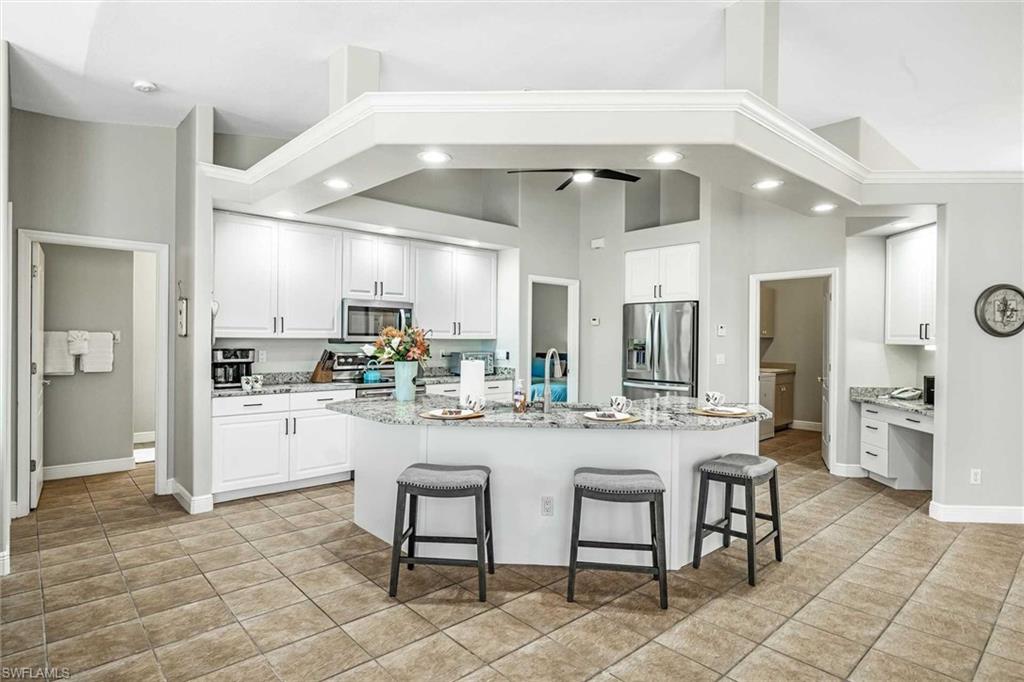 The kitchen is fully equipped & has additional seating for 3 at the bar