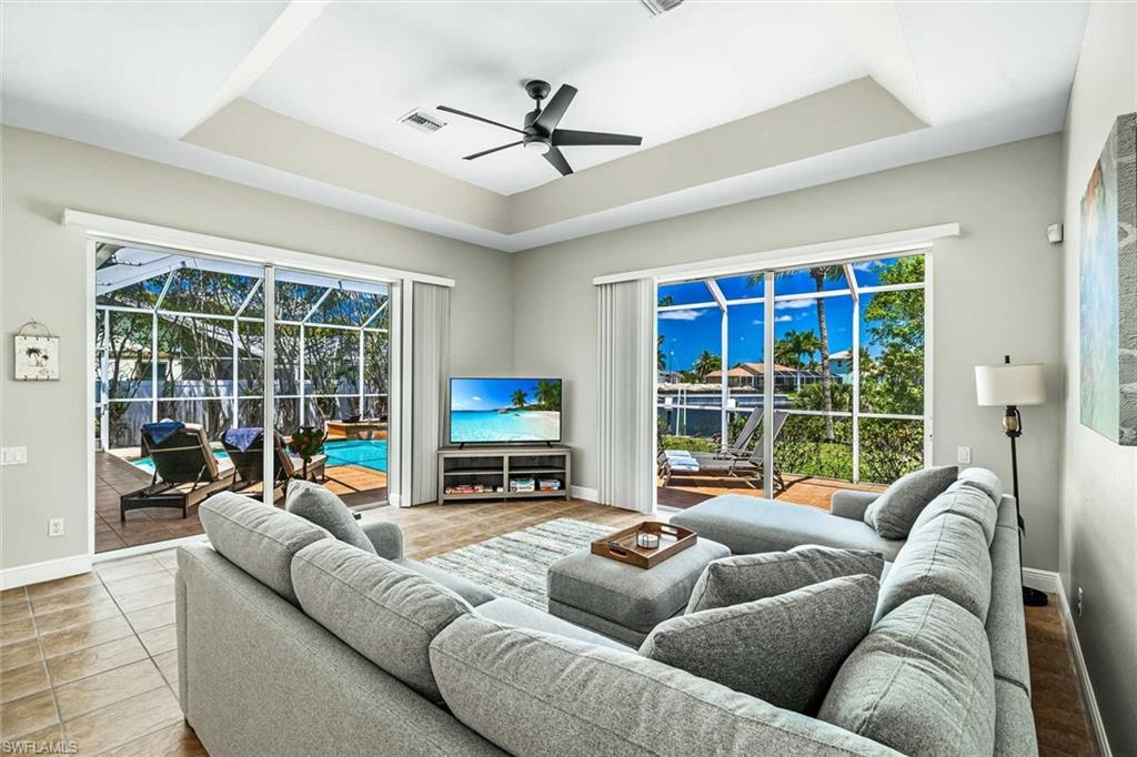 The living room has ample seating & a flat-screen TV