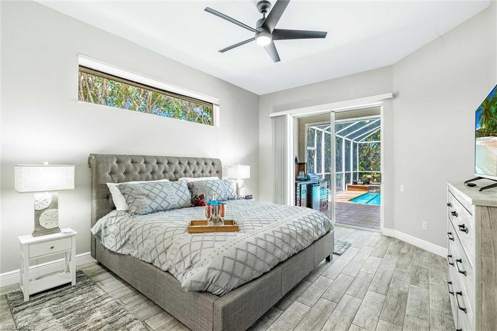 The primary bedroom has a king-size bed & sliders to the pool