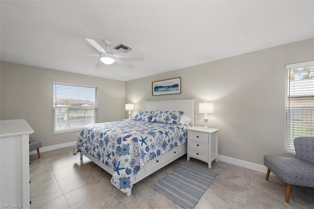 Bedroom with baseboards and ceiling fan