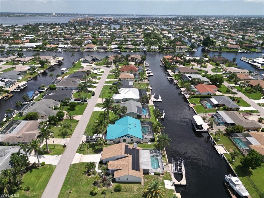 View of property location with nearby suburban area and a nearby body of water