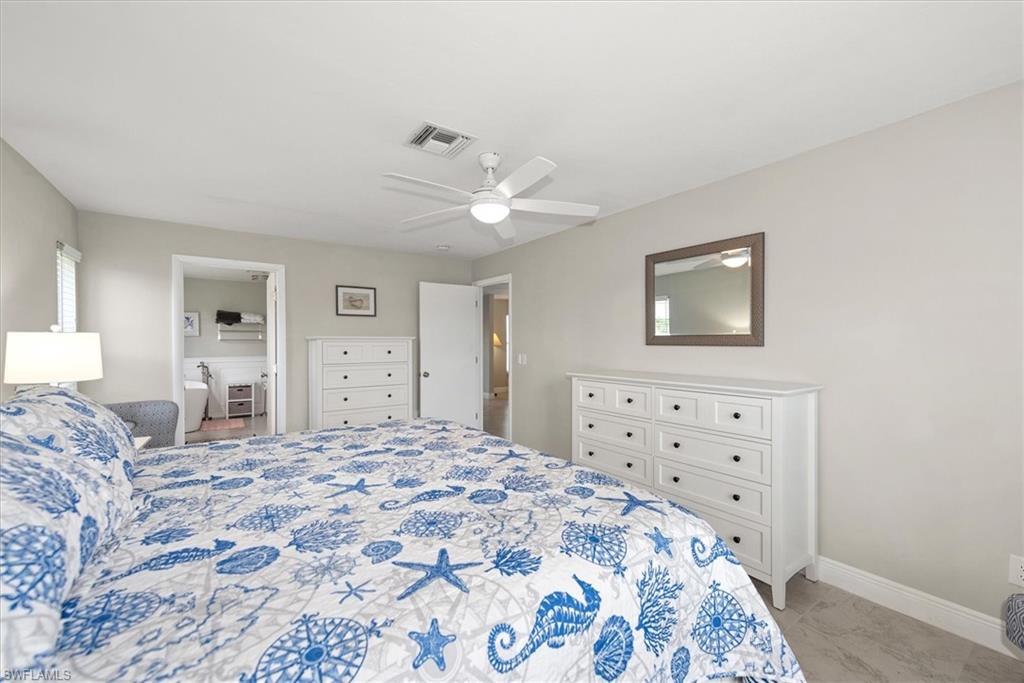 Bedroom with light marble finish flooring and ceiling fan