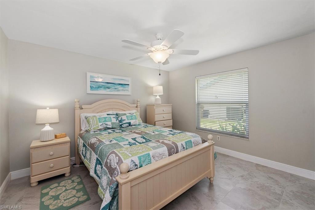 Bedroom with baseboards and a ceiling fan