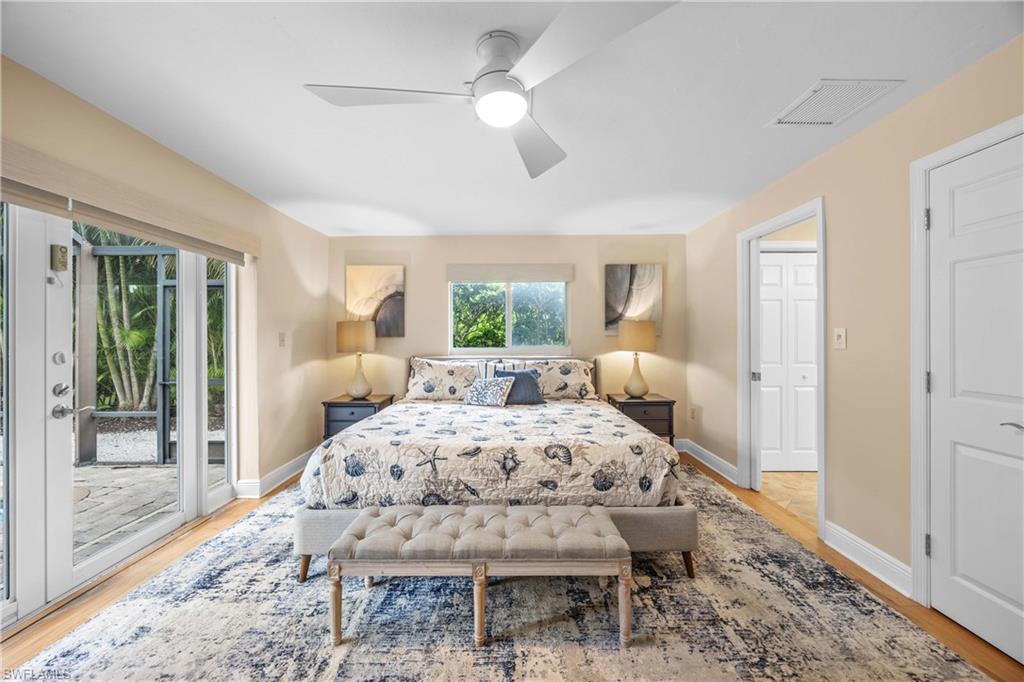 Bedroom featuring access to exterior, ceiling fan, and light wood-type flooring