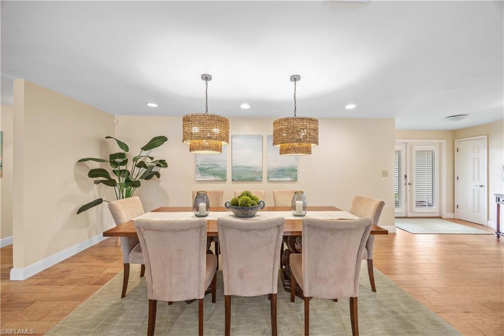 Dining space with light hardwood / wood-style flooring