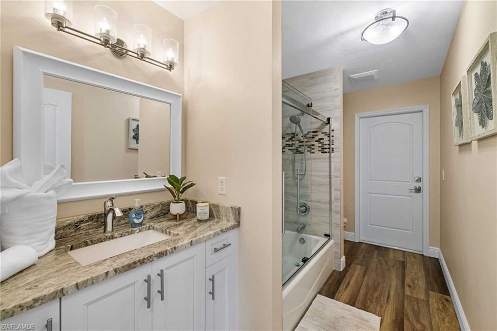 The guest bathroom has a shower/tub combo