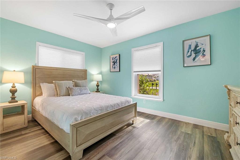 The first guest bedroom offers a queen-size bed