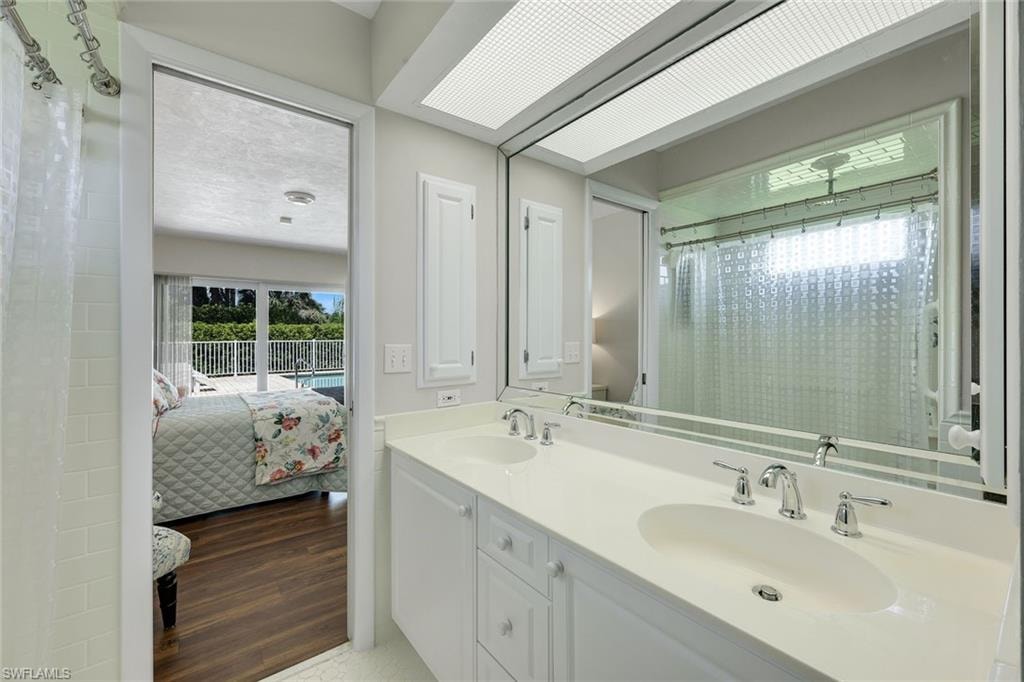 Ensuite primary bathroom features dual sinks.