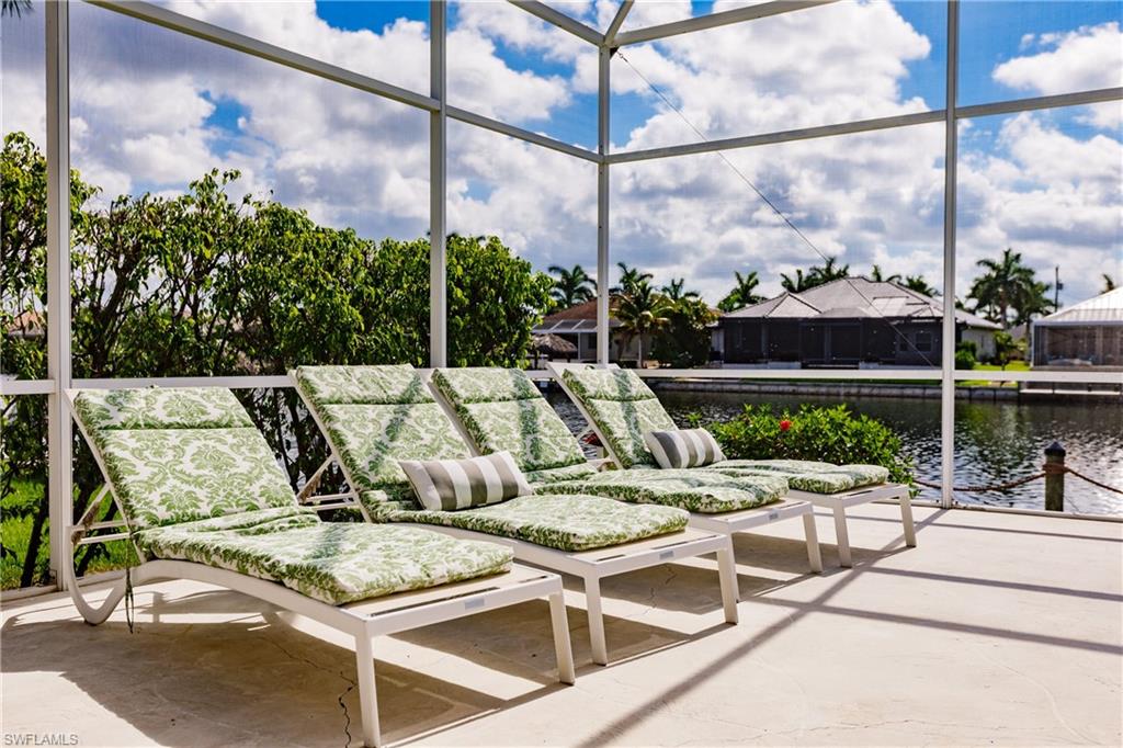 Sunroom / solarium with a water view