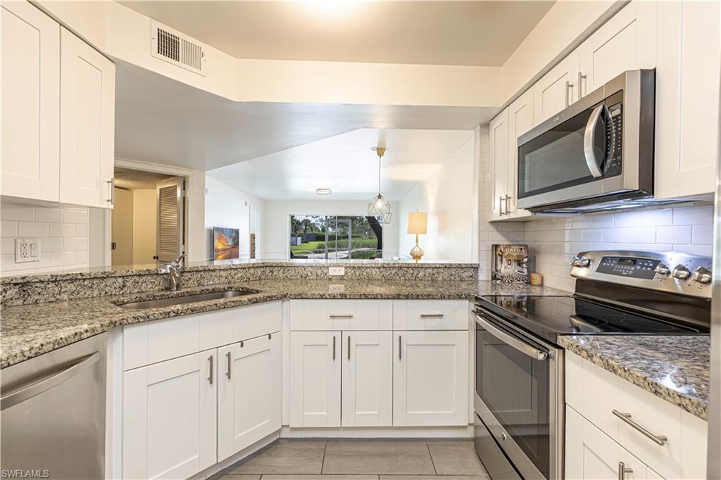 upgraded shaker style cabinets, stainless steal appliances and granite countertops