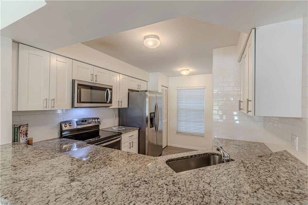 upgraded shaker style cabinets, stainless steal appliances and granite countertops