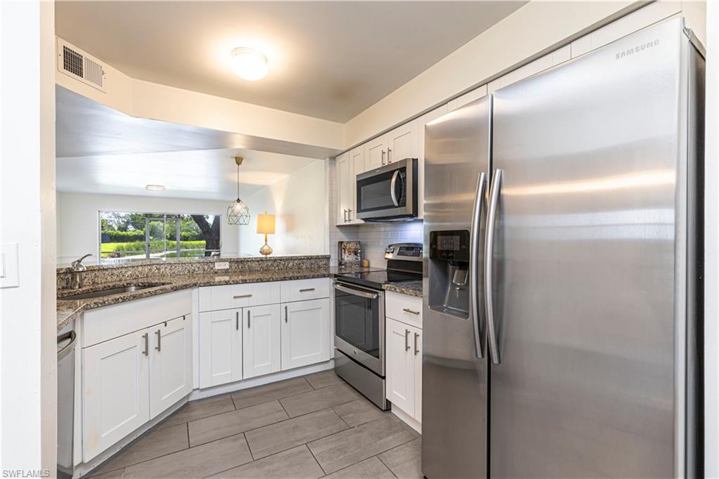 upgraded shaker style cabinets, stainless steal appliances and granite countertops