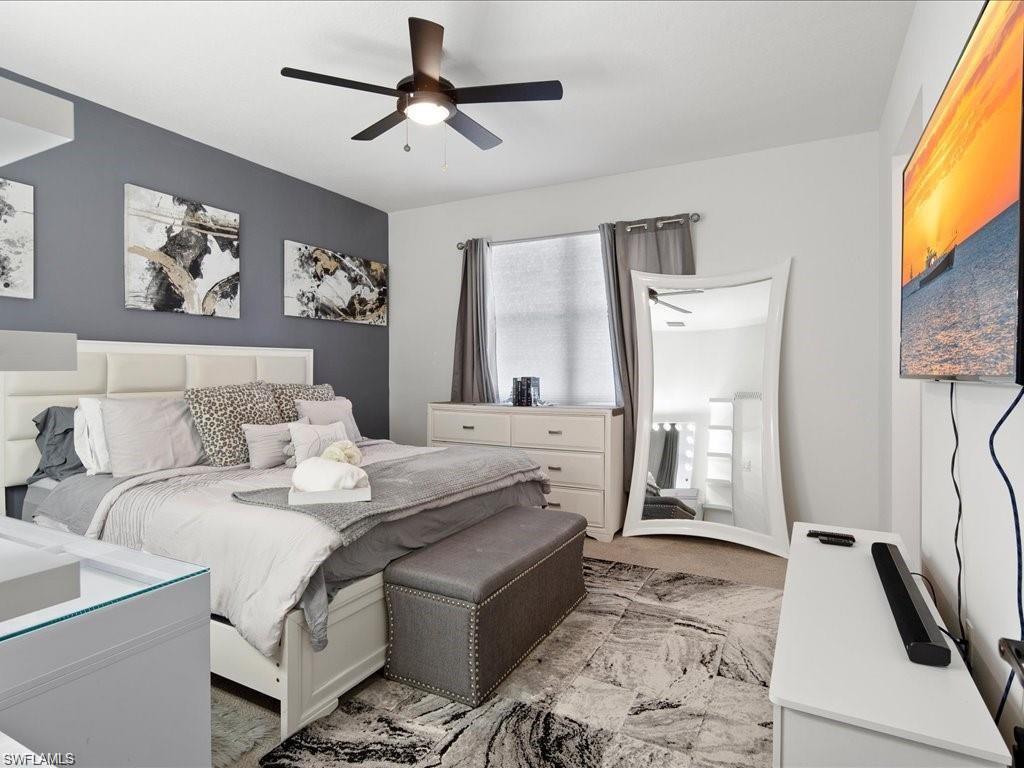 Recessed ceiling with a dark-toned ceiling fan