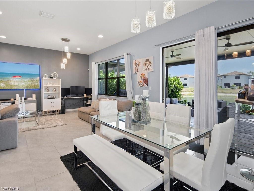 Open-concept interior featuring light gray tile flooring and recessed lighting