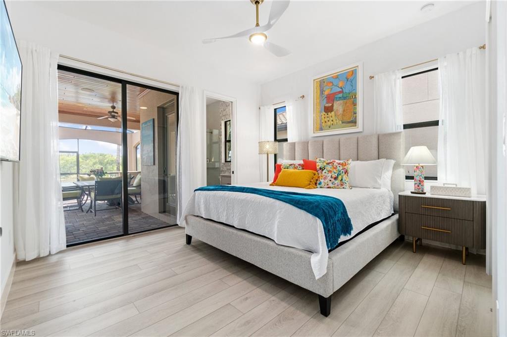 Light wood-finish flooring extending to a spacious screened lanai