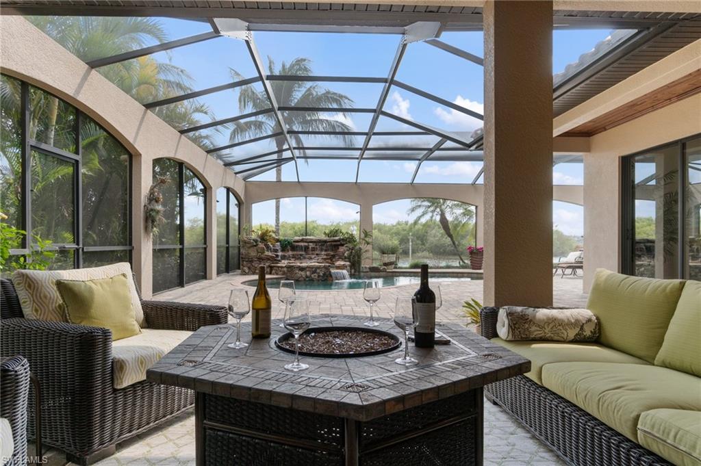 Screened outdoor living area with a paver patio