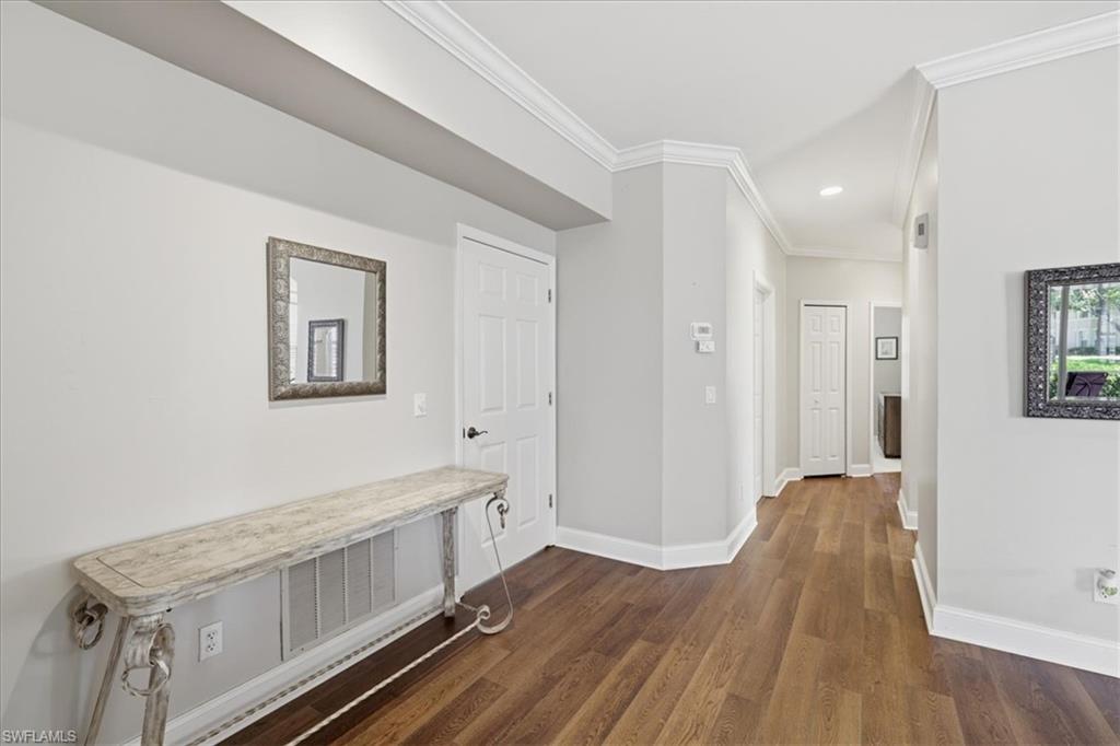 Laundry room door on left, hallway to second bedroom
