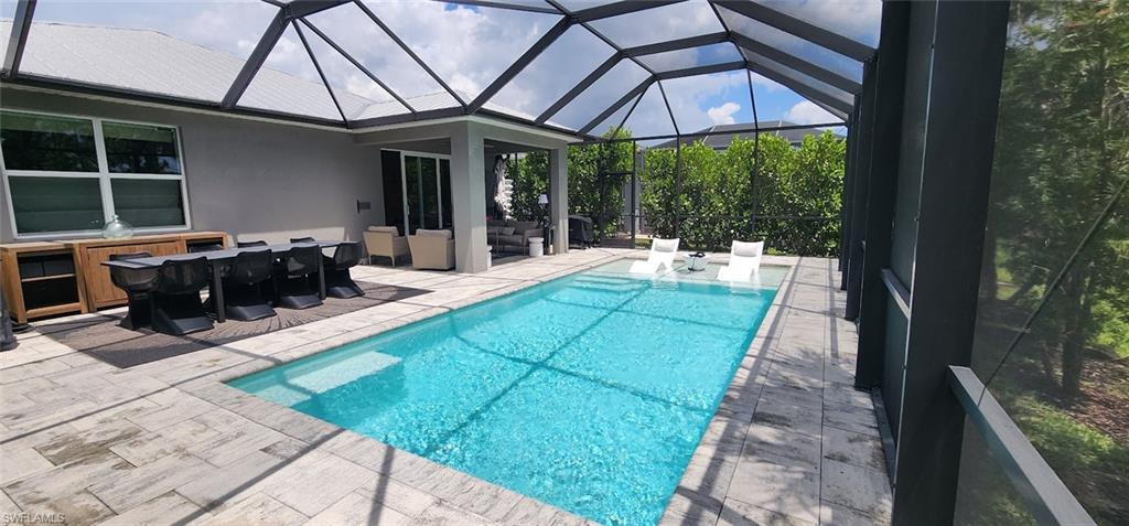 Under cover seating as well as chaise lounge in pool