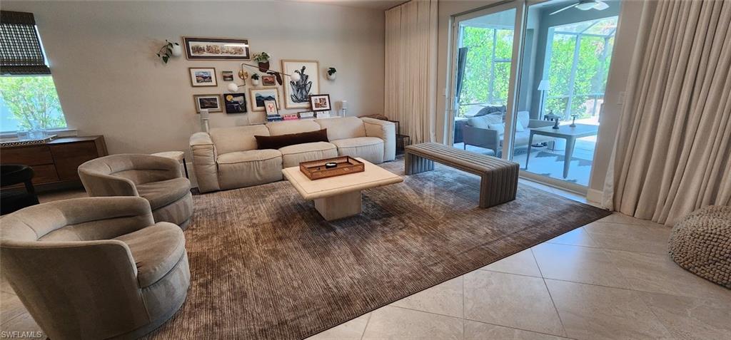 Comfortable living area with oversized mounted TV